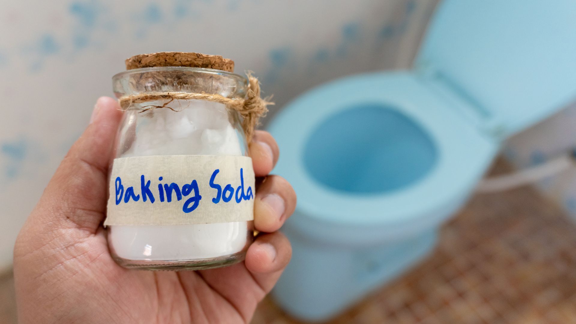 Utilizing the baking soda and vinegar method to unclog a toilet with the expertise of plumbers.